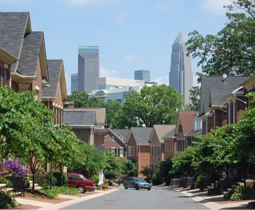 Historic houses on tree-lined streets in Dilworth, a desirable Charlotte NC neighborhood.